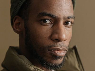 Person sitting in a calm, focused posture with eyes closed.